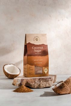 a bag of coconut sugar next to two whole coconuts