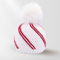 a white knitted hat with red stripes and a pom - pom