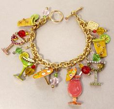 Lunch At The Ritz Charm Bracelet Pool Party LATR 2 Go Tiki Bar  LATR 2 Go, Lunch At The Ritz, Pool Party Charm Bracelet  Features, Margarita, Umbrella, Martini & Various Tiki, Drinks In Enamel & Rhinestones 7.5" Length Rhinestone Set Toggle Clasp 15 Charms , Glass Beads  LATR 2 Go Hang Tag  A Zander Elliot Design jujubee1.etsy.com To Browse My Shop Tiki Drinks, The Ritz, Betsy Johnson, Tiki Bar, Hang Tags, Pool Party, Charm Bracelets, Antique Jewelry, Favorite Jewelry