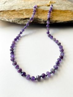 "Amethyst Knotted necklace. -6mm amethyst beads. -Gold plated findings. Necklace length from 14\" to 30\"+ 3 inches chain extender. * Custom orders are welcome.. Every once in awhile, you see things that bring you pure joy. Admire this necklace and smile as others do the same when you wear it.  Note: The beads are all natural and unique. Therefore, they may not have the same pattern or exact look as those seen in the picture.  Thank you!! *Custom orders welcome." Adjustable Amethyst Beaded Necklace In Lavender, Adjustable Purple Necklace With Faceted Beads, Lavender Crystal Necklaces With Faceted Beads For Gifts, Purple Beaded Necklaces For Healing With Round Beads, Lavender Faceted Beads Crystal Necklace Gift, Lavender Faceted Beads Necklace For Gifts, Lavender Necklace With Faceted Beads Gift, Spiritual Single Strand Purple Beaded Necklace, Purple Adjustable Crystal Necklaces With Faceted Beads