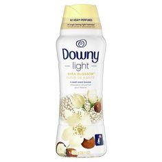 downy light deodorant with flowers and nuts on the front, in a bottle