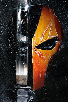 a close up of a person wearing a mask and holding a knife in the rain