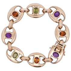 Pre-Owned 18k Yellow Gold Bracelet Comprised Of Gucci Style Links Centered By Semi Precious Stones Featuring Oval Cut Citrine, Peridot And Amethyst. Stamped On The Closure "750" And Maker "Mg". Total Bracelet Weight: 47.5 Grams (30.6 Dwt) Circa: 1980s Origin: Usa Dimensions: L: 8" Condition: Great Condition. Semi Precious Stone Bracelet, Gucci Style, Stone Feature, Gucci Fashion, Semi Precious Stone, Yellow Gold Bracelet, Semi Precious Stones, Stone Bracelet, Oval Cut