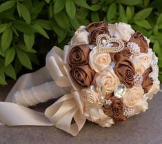 a bridal bouquet sitting on top of a stone wall