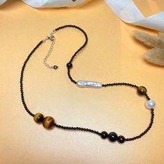 Color: Tiger Eye Agate Pearl Necklace Fashion Element: Circle, Ellipse, Polka Dot, Line Style: Boyfriend style Elegant Agate Beaded Chain Necklaces, Elegant Agate Beaded Chain Necklace, Elegant Agate Beaded Chain Jewelry, Boyfriend Style, Linnet, Tiger Eye, Fresh Water, Freshwater Pearls, Pearl Necklace