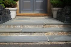 steps lead up to the front door of a house