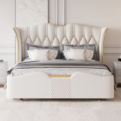 a large white bed sitting in a bedroom next to a night stand and nightstands