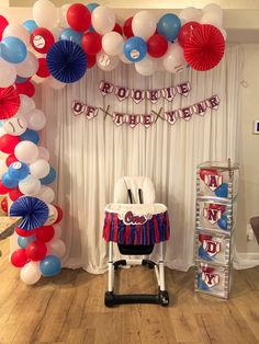 a party setup with balloons and decorations for a fourth of july celebration on the dance floor