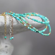 This handmade, genuine Turquoise Bracelet for women is dainty yet striking, bringing a colourful, boho touch to any outfit. Stylish and minimal worn alone, but great to mix, match & stack. A very dainty, skinny bracelet with a delicate, feminine, minimal look - made with 2.25mm tiny turquoise beads. Featuring genuine, natural, un-dyed Turquoise in a variety of green, turquoise and teal shades - all the beautiful shades of the tropical seas! Excellent cut with many facets, showing off the gor Turquoise Bracelets With Tiny Beads As Gift, Turquoise Bracelets With Tiny Beads For Gifts, Turquoise Beaded Bracelet As A Gift, Turquoise Wrap Bracelet With Faceted Beads As Gift, Spiritual Turquoise Bracelets With Tiny Beads, Turquoise Bracelets With Faceted Beads For Gift, Turquoise Friendship Bracelets With Faceted Beads, Handmade Turquoise Anklet Bracelet, Teal Shades