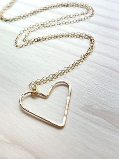 Dainty Gold filled hammered floating heart pendant necklace. Measures 18" in length. An everyday must have. Handmade in the USA. All jewelry items are delivered to you wrapped perfect for gift giving! Open Heart Necklace For Anniversary Gift, Open Heart Charm Necklaces For Anniversary Gift, Hammered Heart-shaped Jewelry Gift, Handmade Open Heart Necklace For Anniversary Gift, Floating Heart Necklace, Love Necklace, Heart Pendant Necklace, Gift Giving, Heart Necklace