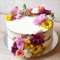 a close up of a cake with flowers on it