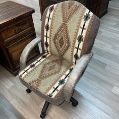 a chair that is sitting in front of a desk