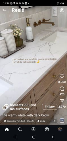 a bathroom sink with white marble counter top