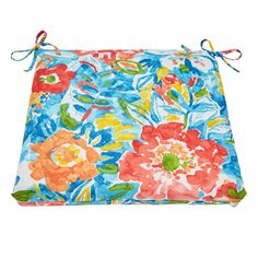 a blue and orange floral print pillow with ties