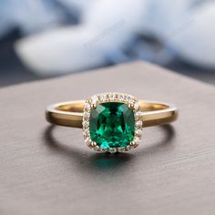 Cushion Emerald Ring, Gold Emerald Ring With Halo For Anniversary, Gold Emerald Ring With Halo, Cushion Cut Emerald Ring, 14k Gold Emerald Ring With Halo Design For Promise, Wedding Emerald Ring With Halo Design For May Birthstone, Emerald Halo Ring For May Birthstone Wedding, Classic Wedding Halo Ring For May Birthstone, 14k Gold Emerald Ring With Halo Setting For Wedding