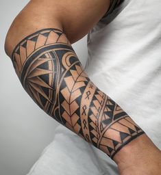 a man with a tattoo on his arm