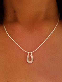 "This Beautiful Equestrian Jewelry genuine .925 Sterling Silver CZ Horse Shoe Pendant on 16\" is the perfect addition for the horse lovers jewelry . We also have a Chain on 18\"and 20\" This horse shoe pendant 1/2\" by 5/ 16, the total weight of this necklace is 0.8 grams. We have recreated this fashioned in to our earrings and pendants. This is a link of earrings: https://etsy.me/2mgJX6k I guarantee all my sterling silver pieces to be genuine .925 and are stamped as such We believe in using bet Classic Sterling Silver Horseshoe Jewelry, Classic Horseshoe-shaped Sterling Silver Jewelry, Horse Jewelry Necklaces, Silver Horseshoe Necklace, Equestrian Necklace, Necklace Lock, Be Genuine, Horseshoe Jewelry, Horseshoe Pendant