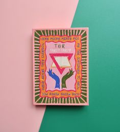 a pink and green square shaped brochure with two hands reaching for something on it