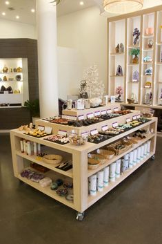 a display case filled with lots of different types of shoes and other items on shelves