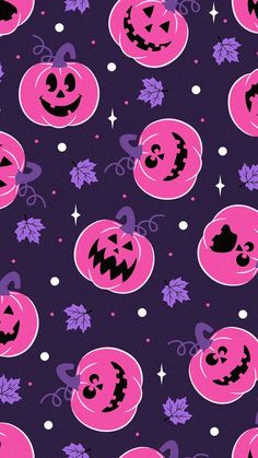 halloween pumpkins with faces and leaves on a purple background