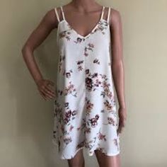 Nwot Rare White Lily Floral Brandy Melville Selda Dress. Fits Xs-M. Comes With Free Stickers. Check Out The Rest Of My Closet! Floral Print V-neck Sundress For Daytime, Daytime Floral Print V-neck Sundress, V-neck Floral Print Sundress For Daytime, Daytime Feminine V-neck Sundress, Sleeveless Floral Dress For Daytime, Floral Brandy Melville, White Lily, White Lilies, Free Stickers