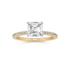 an engagement ring with a square cut diamond in the center and pave set shoulders