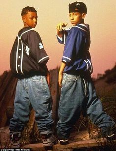 two young boys standing next to each other