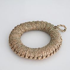 a piece of jute rope hanging from a hook