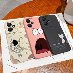 three iphone cases with cartoon characters on them