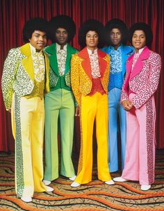 the jacksons pose for a portrait in their colorful outfits