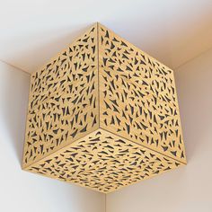 an intricately designed light fixture hangs from the ceiling