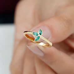 Product Details Show your girl that you want the best for her by gifting her this adorable Petal Ring on Valentines Day as a token of your love. The Promise Ring crafted in Solid Gold has three Marquise Cut Emerald Gemstones set in the petal like frame in a bezel setting. Product Information SKU SHP-RINGS0721117406 Width 2.5 mm Height 9 mm Weight 1.76 gm (Approximate) EMERALD INFORMATION No.of Stones 3 Pieces Total Weight 0.36 Carat (Approximate) Dimension(approx) Marquise-2X4 mm-3 Pcs Color Gre Petal Ring, May Birthstone, Ring Crafts, 18k Yellow Gold Ring, Emerald Gemstone, Vibrant Green, Marquise Cut, Promise Ring, Birthstone Jewelry