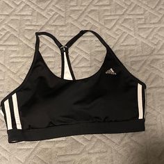 Cute Adidas Sports Bra! Built In Pads. Never Worn Black Sporty Activewear With Three Stripes, Sporty Activewear With Three Stripes For Sports, Adidas Gym Activewear With Three Stripes, Adidas Three Stripes Gym Activewear, Sporty Activewear With Three Stripes For Workout, Three Stripes Sportswear For Sports, Sporty Three-stripes Activewear For Training, White Adidas Activewear For Gym, Adidas Stretch Activewear For Sports Events