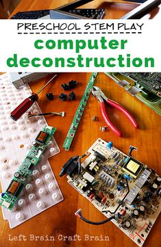 an electronic circuit board sitting on top of a wooden table next to a laptop computer