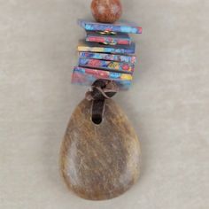 there is a rock with some beads on it