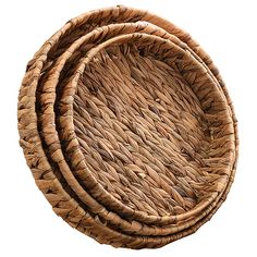 three round woven baskets sitting on top of each other