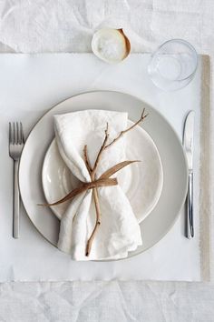 a white plate topped with a napkin and fork