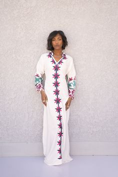 "This stunning kaftan with its monotone embroidery will be your summer favorite. It is an extremely comfortable wear, light and soft and can be used on many occasions - home gatherings, festival parties, summer occasions, dinners, or just in your home to feel comfortable. Fabric : 80% Egyptian Cotton and 20% Polyester Sizes : This Kaftan comes in two sizes. Size S/L which fits anywhere between a small and a large. and an XL/2XL which fits an XL to 2XL. Kaftan measurements : Size S/L : Bust 47 in Multicolor Embroidered Long Maxi Dress, Maxi Length Kaftan With Multicolor Embroidery, Geometric Embroidered Kaftan For Vacation, Geometric Embroidery Kaftan For Vacation, White Embroidered Kaftan For Spring, White Bohemian Abaya For Spring, White Kaftan With Floral Embroidery In Tunic Shape, White Maxi Dress For Eid Vacation, Spring White Kaftan With Embroidered Border