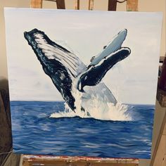 a painting of a whale jumping out of the water