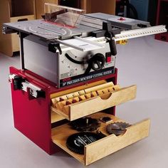 a table saw is sitting on top of drawers