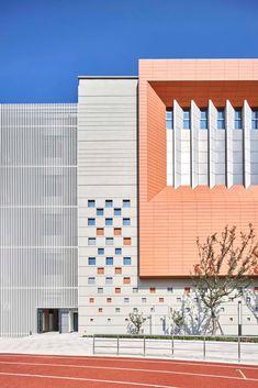 an orange and white building on the side of a road