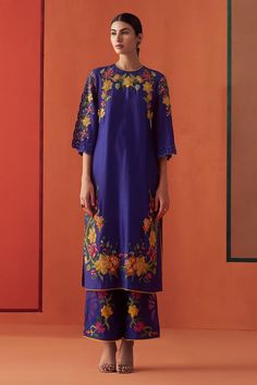 Cobalt blue chanderi kurta with multi-colored beads and floral applique embroidery. Comes with pant.
Components: 2
Pattern: Applique embroidered
Type Of Work: Beads, Floral
Neckline: Round
Sleeve Type: Flared Sleeves
Fabric: Chanderi, Lining : 100% Cotton
Color: Blue
Other Details: 
Attached lining
Model Height : 5 ft 6 inches, wearing size S
Occasion: Sangeet - Aza Fashions Embroidered Beads, Tunic Designs, Embroidered Kimono, Embroidered Pants, Organza Dupatta, Kurta With Pants, Floral Applique, Pant Set, Blue Beads