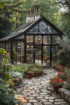 a garden with lots of potted plants and flowers