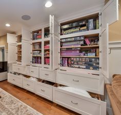 a living room filled with lots of white furniture