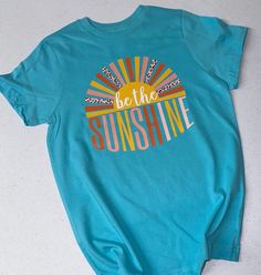 Welcome to Cotton & Pearls Vinyl!!  Always be the sunshine! This unisex fit Bella canvas tee will come with the be the sunshine design as shown above in the shirt color of your choice. Color chart is pictured above. All shirts are short sleeve. All designs are hand pressed with professional grade heat transfer vinyl. Please leave shirt color in the personalization box.  Xs- 3x Sunshine Tshirt Design, Short Sleeve T-shirt With Heat Transfer Vinyl For Summer, Inspirational Short Sleeve T-shirt For Summer, Inspirational Graphic Print T-shirt For Summer, Casual Summer T-shirt With Heat Transfer Vinyl, Cute Custom Print Summer T-shirt, Inspirational Crew Neck Summer Top, Inspirational Cotton Summer Tops, Unisex Custom Print T-shirt For Summer