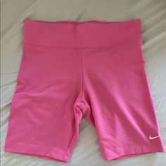 Nike 16.5 In Biker Pink Shorts Nike Shorts With Built-in Shorts, Nike Bottoms With Built-in Shorts And Short Inseam, Nike Spring Activewear Shorts, Nike Spring Activewear, Nike Bottoms With Built-in Shorts, Nike High-waisted Shorts In Athleisure Style, Nike Stretch Sportswear Shorts, Spring Sports Knee-length Shorts, Nike Stretch Bottoms With Built-in Shorts