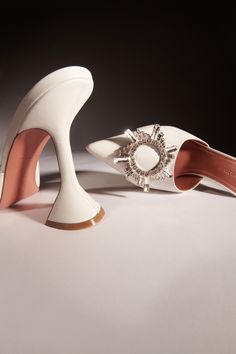 BEGUM MULE - Amina Muaddi - Official Site Amina Muaddi Bridal Shoes, Amina Muaddi White Heels, Luxury White Mules With Sculpted Heel, Designer White Leather Mules, Luxury White Mules For Evening, Luxury White Evening Mules, White Luxury Formal Mules, Designer White Pointed Toe Mules, White Designer Mules With Pointed Toe