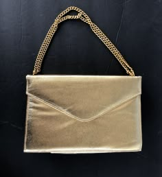 "Vintage Handbag Gold Etra envelope evening bag snap closure under flap gold tone handle can be double or single for different lengths bright shiny gold lame exterior one internal zip pocket 8\" L x 5 1/4\" H x 2\" depth Bag is in excellent vintage condition" Cheap Single Compartment Gold Shoulder Bag, Affordable Gold Shoulder Bag, Gold Purse Outfit, Purse Outfit, Metallic Clutch, Janet Guzman, Gold Lame, Gold Clutch, Vintage Handbag