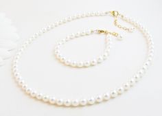 "Real Pearl Necklace and Bracelet Set for Infant, Baby or Girl: This durable heirloom quality jewelry set is created with gorgeous Grade-A 5.5mm round freshwater pearls. They each close with a gold-filled oval lobster clasp and an attached \"Grow with Me\" gold-filled extender chain (1.25\" on the necklace, 1/2\" on the bracelet). The pearls are strung on super strong, gold colored stainless-steel wire for extra durability. All metal components are 14K gold-filled. For necklace size reference, the model in white is 9 and wearing 15\". The model with sunglasses just turned 2 and is wearing 14\". Arrives packaged together in a gift box. S I Z I N G . G U I D E S BRACELET: A perfect fit is 3/4\" larger than the child's snug wrist measurement. If you are unable to measure, you may use this gui Father Daughter Jewelry, Real Pearl Bracelet, Coral Jewelry Set, Real Pearl Earrings, Pearl Jewelry Set, Vintage Wedding Jewelry, Real Pearl Necklace, Freshwater Pearl Jewelry, Daughter Jewelry