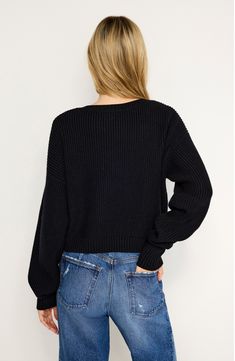 Knit with a deep V-neckline that can easily be worn off the shoulder, this warming ribbed sweater features an on-trend slouchy fit that'll keep you cozy and cute. V-neck Long sleeves Ribbed cuffs and hem 48% viscose, 28% polyester, 24% nylon Dry clean or hand wash, dry flat Imported Black Owned/Founded Slouchy Ribbed Sweater For Fall, Trendy Ribbed V-neck Winter Sweater, Trendy Ribbed V-neck Sweater For Winter, Trendy V-neck Cropped Sweater For Fall, Spring Ribbed V-neck Cropped Sweater, Trendy V-neck Cropped Sweater, Trendy Ribbed Knit Cropped Sweater, Casual Ribbed Cropped Sweater For Fall, Black Ribbed Long Sleeve V-neck Sweater